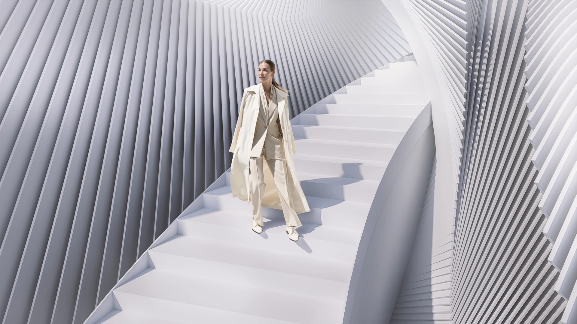 GFT Technology Kampagnenbild – Frau im hellen Anzug auf gewundener Treppe mit charakteristischer GFT-Markenarchitektur – Konzipiert von LässingMüller